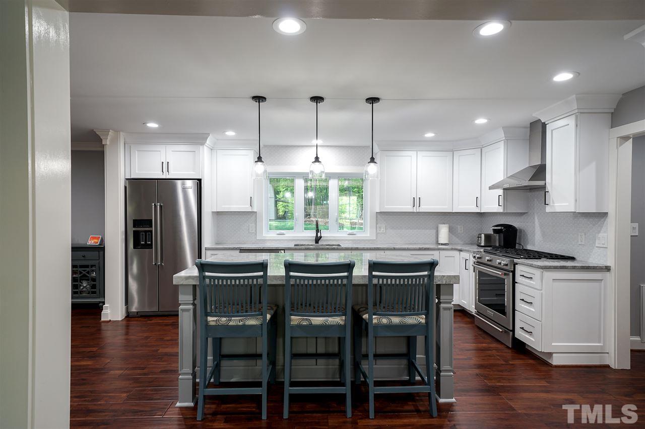 10100 Touchwood Place Raleigh, NC 27613 - Photo 4 of 26 Island, great work surface plus kitchen dining.