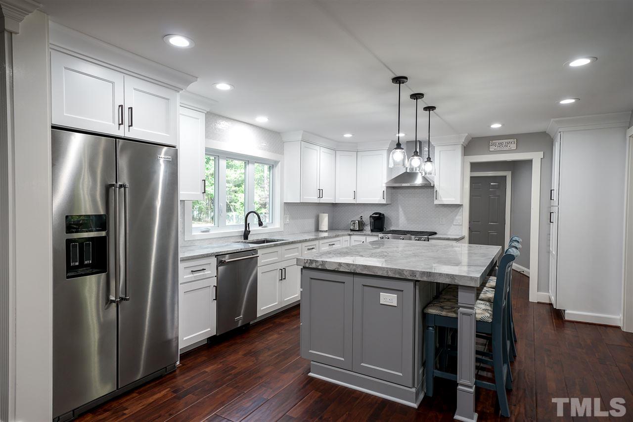10100 Touchwood Place Raleigh, NC 27613 - Photo 5 of 26 Natural Stone counter tops, SS appliances.