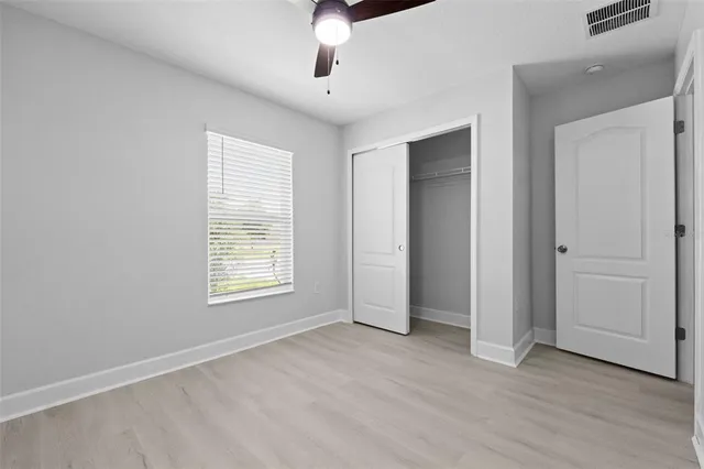 a bathroom with a sink a toilet a shower and a mirror