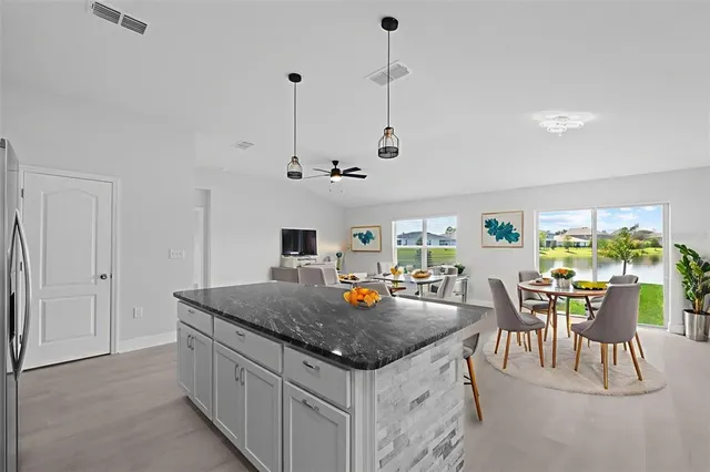 a view of a dining room with furniture window and outside view