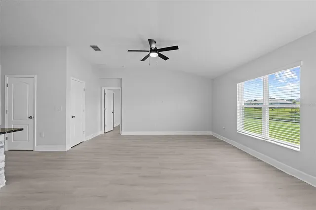 a bedroom with a large bed and a flat screen tv