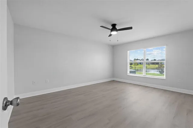 a view of a lake with houses in the back