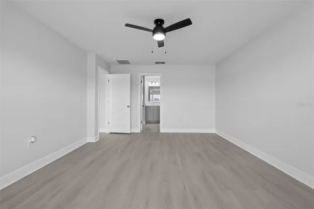 an aerial view of a residential houses with outdoor space