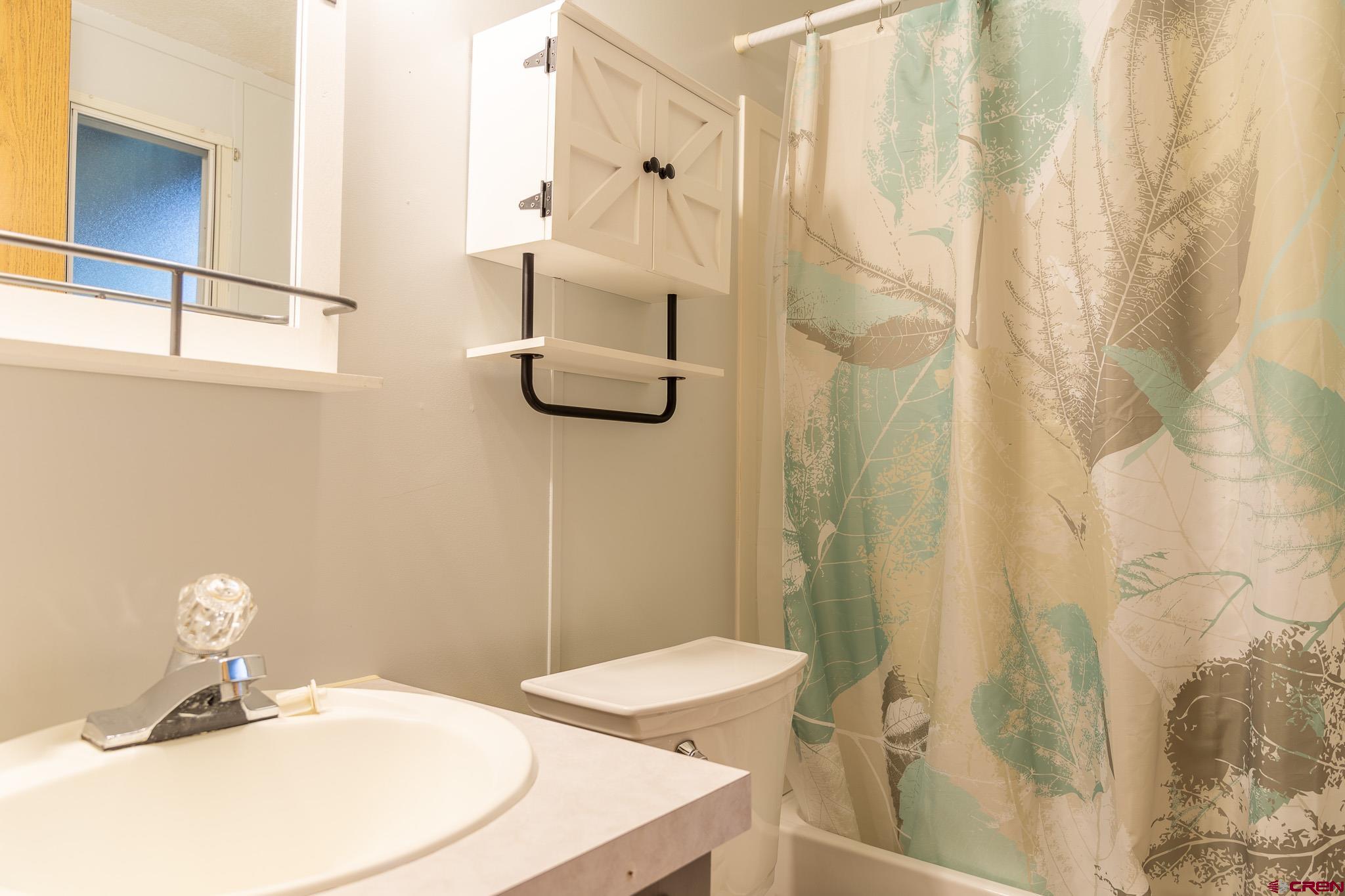 263 Mountain River Drive Bayfield, CO 81122 - Photo 14 of 21 a bathroom with a sink and mirror