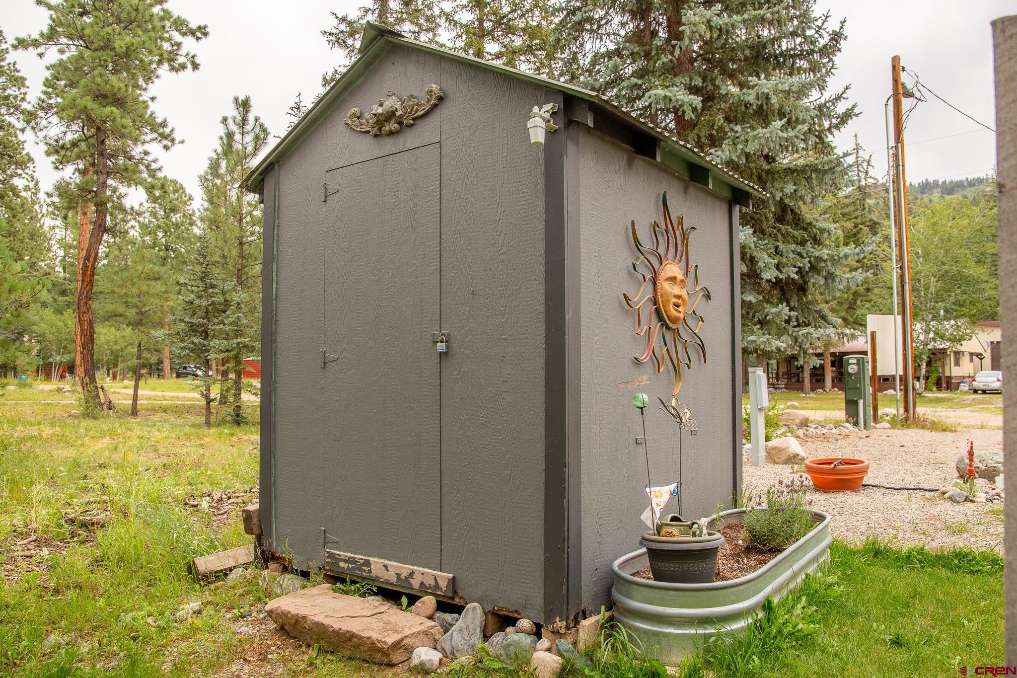 263 Mountain River Drive Bayfield, CO 81122 - Photo 15 of 21 a backyard of a house with table and chairs
