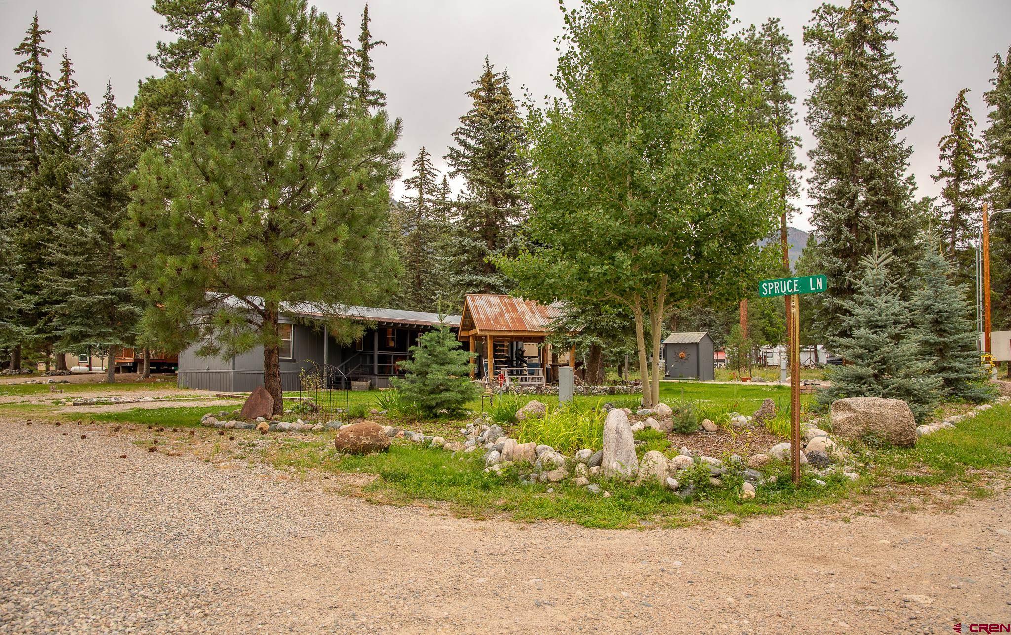 263 Mountain River Drive Bayfield, CO 81122 - Photo 20 of 21 a front view of a house with a yard