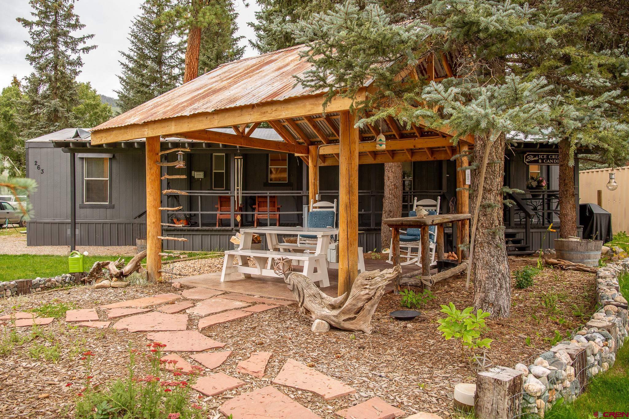 263 Mountain River Drive Bayfield, CO 81122 - Photo 4 of 21 a view of a house with backyard porch and sitting area