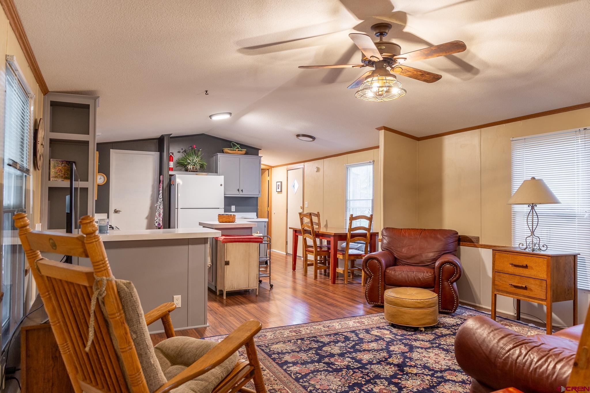 263 Mountain River Drive Bayfield, CO 81122 - Photo 6 of 21 a living room with furniture and wooden floor