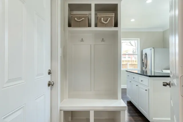 a bathroom with a mirror and a shower
