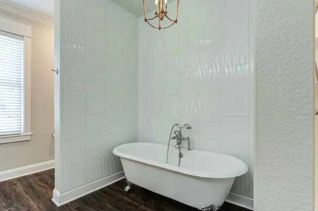 a bathroom with a sink and a window