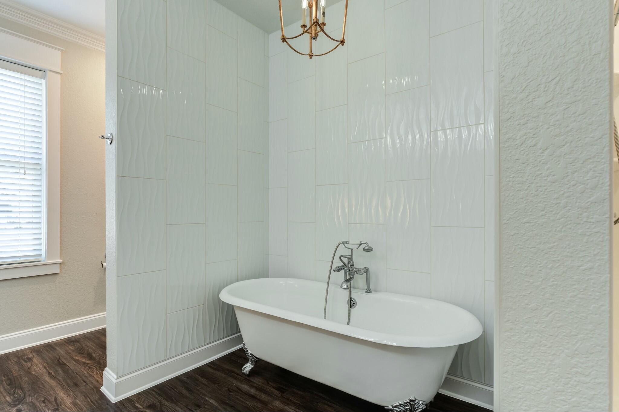3219 22nd Street Lubbock, TX 79410 - Photo 30 of 51 a bathroom with a sink and a window