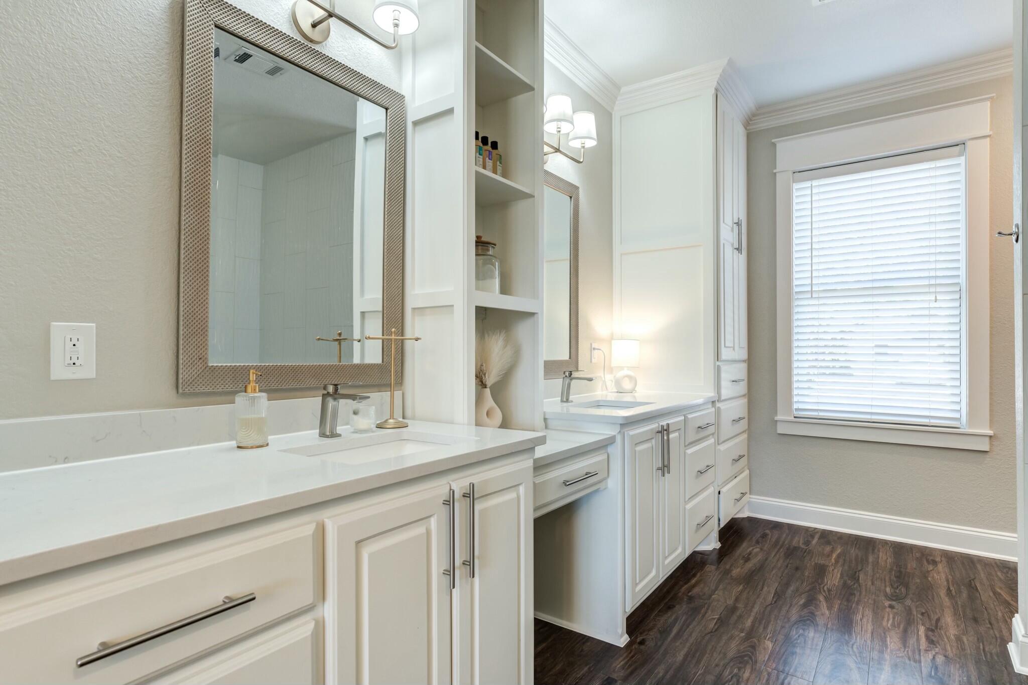 3219 22nd Street Lubbock, TX 79410 - Photo 31 of 51 a bathroom with a granite countertop sink mirror and a