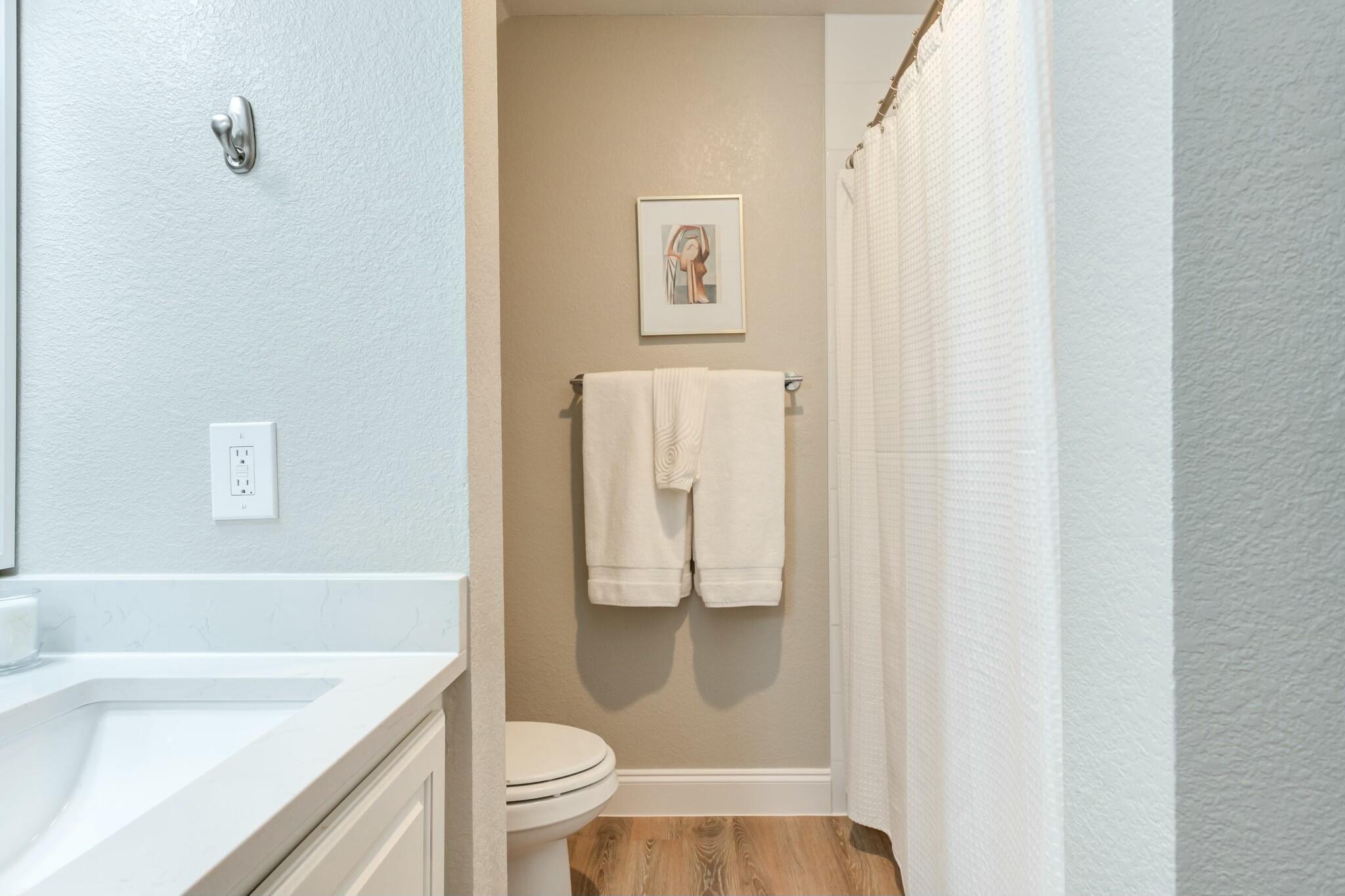 3219 22nd Street Lubbock, TX 79410 - Photo 46 of 51 a bathroom with a granite countertop sink toilet and shower
