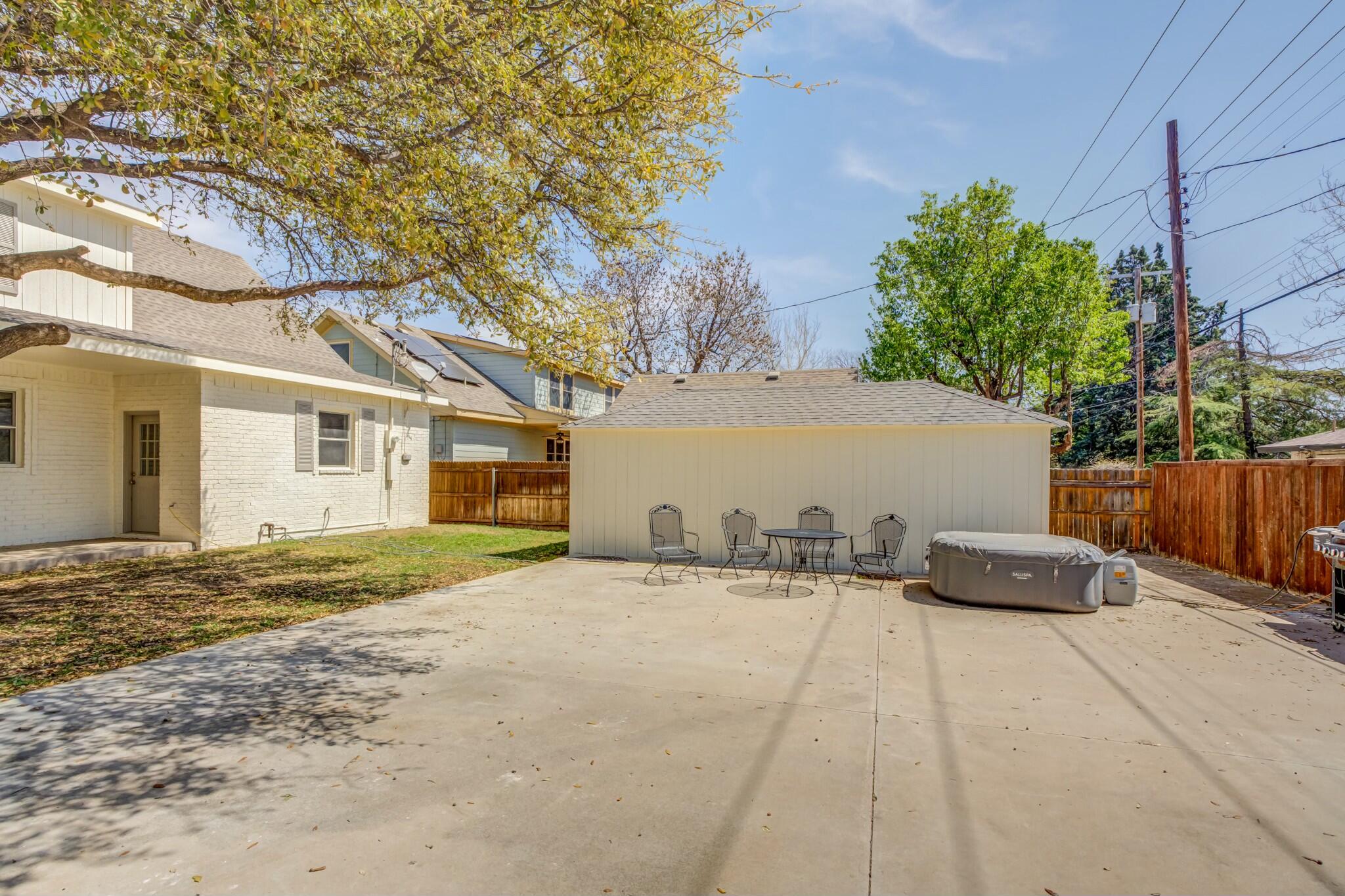 3219 22nd Street Lubbock, TX 79410 - Photo 50 of 51 a couple of cars parked in front of a house