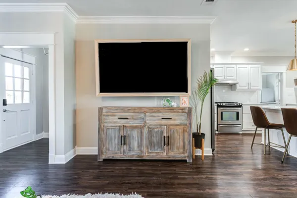 a view of living room with furniture and flat screen tv