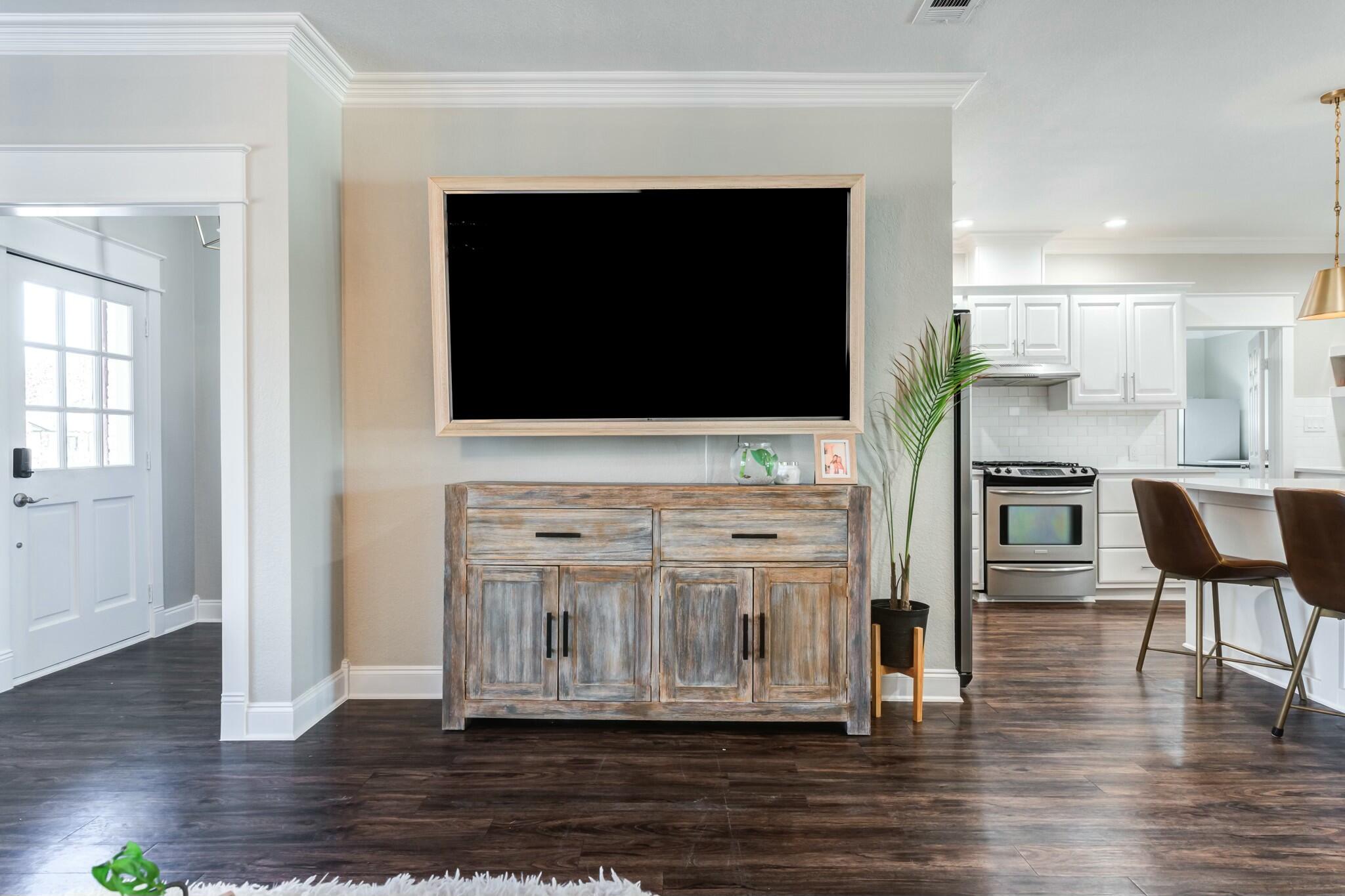 3219 22nd Street Lubbock, TX 79410 - Photo 9 of 51 a view of living room with furniture and flat screen tv