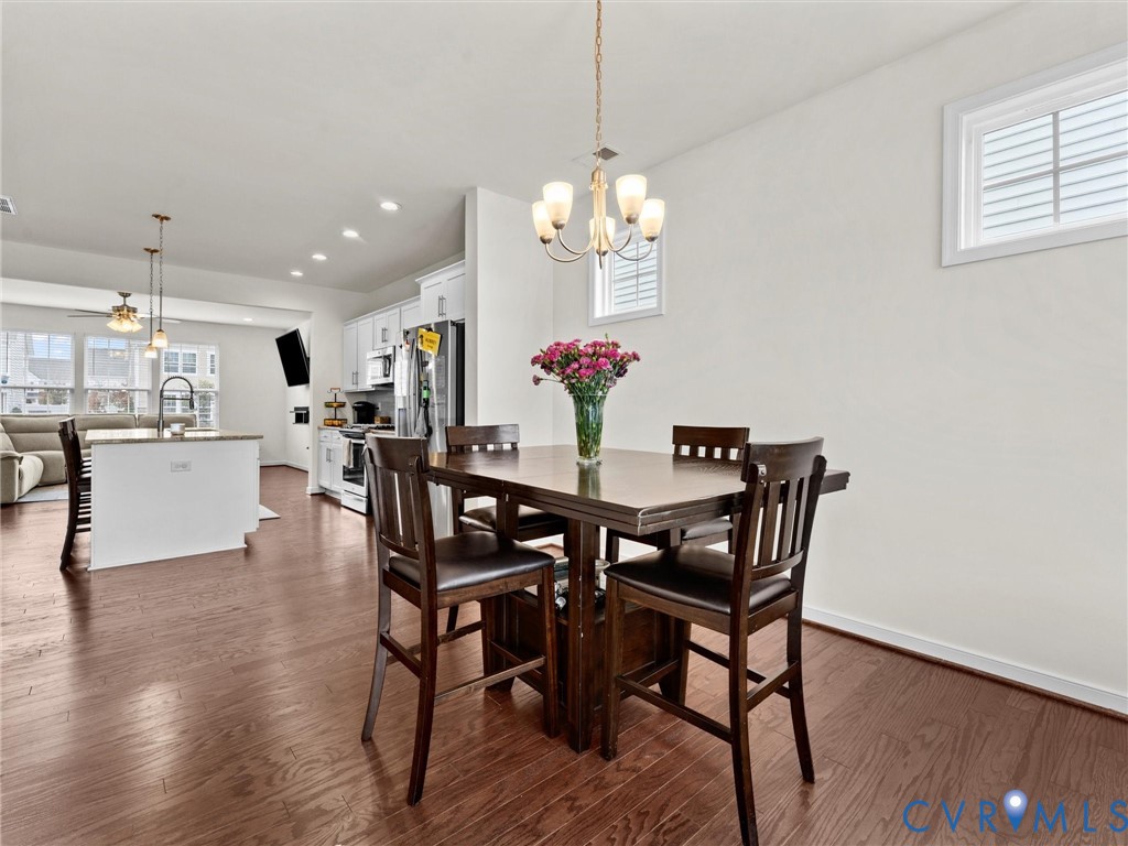 6135 Buntline Lane Richmond, VA 23234 - Photo 17 of 34 a view of a dining room with furniture and wooden floor