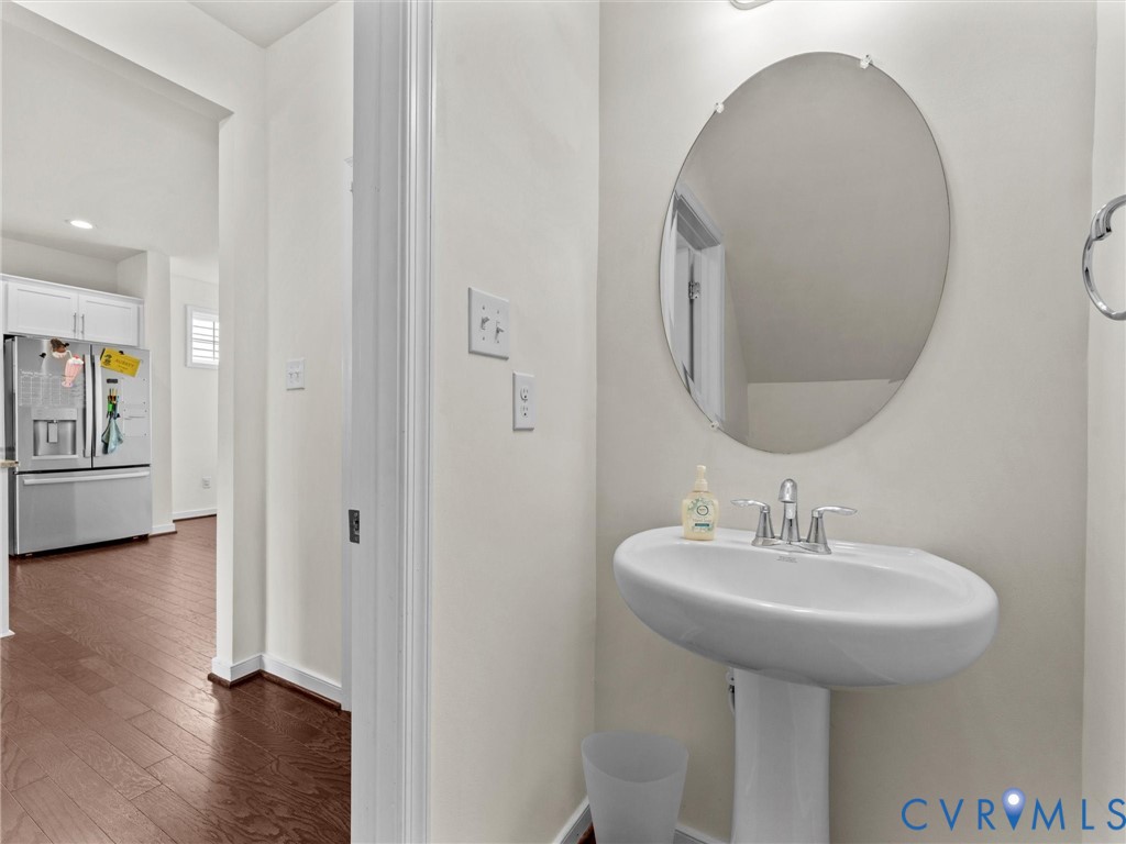 6135 Buntline Lane Richmond, VA 23234 - Photo 18 of 34 a bathroom with a sink and a mirror