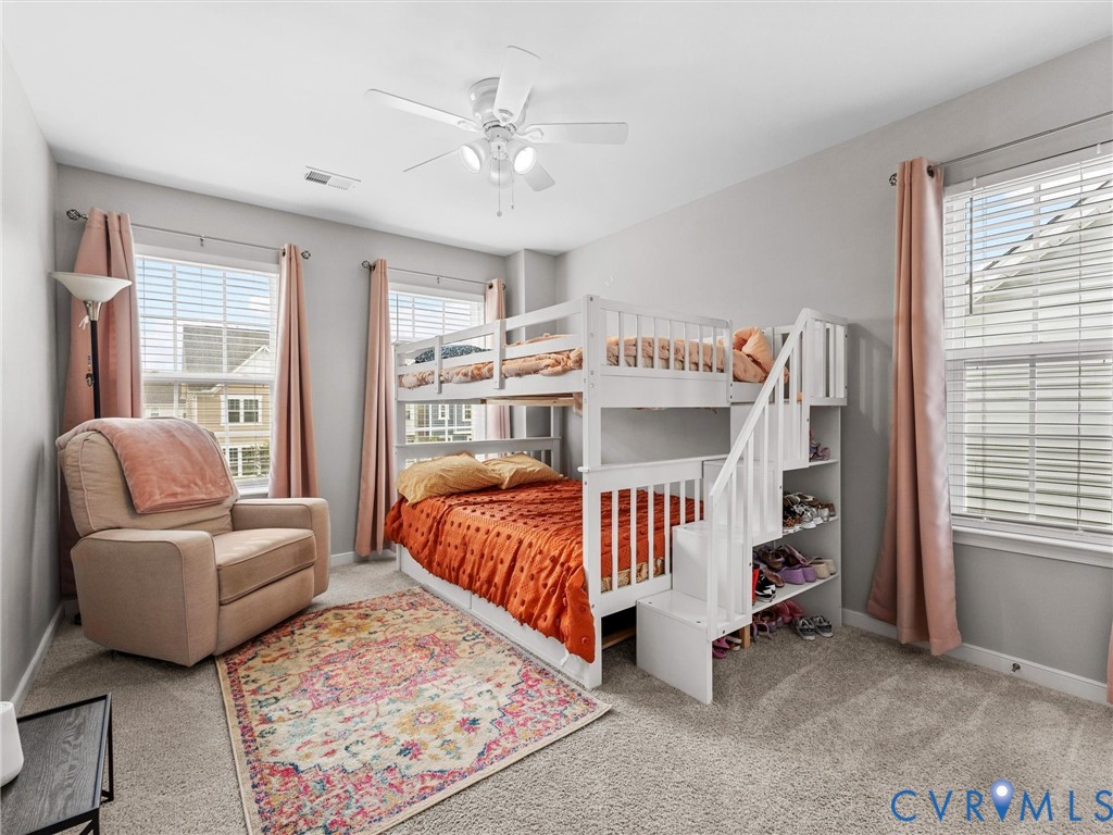 6135 Buntline Lane Richmond, VA 23234 - Photo 24 of 34 a bed room with furniture and a window
