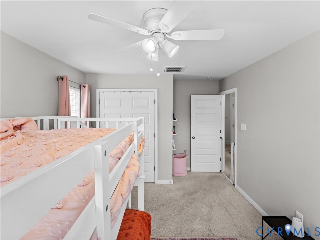 6135 Buntline Lane Richmond, VA 23234 - Photo 27 of 34 a spacious bathroom with a sink and a mirror