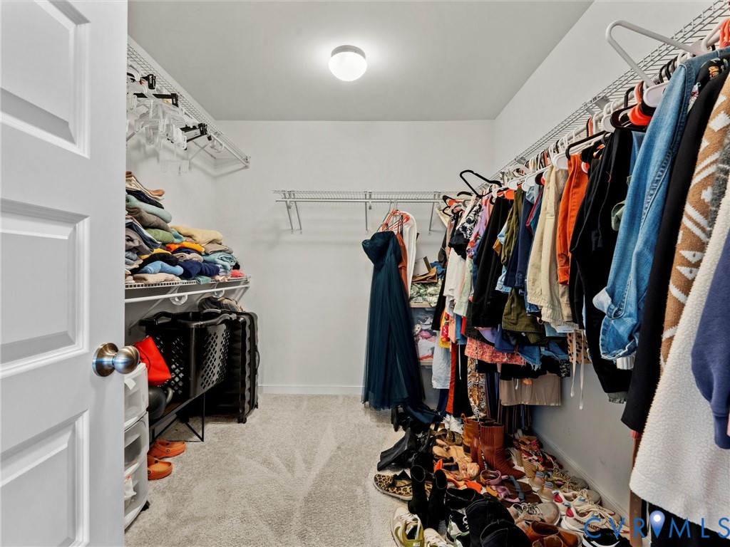 6135 Buntline Lane Richmond, VA 23234 - Photo 33 of 34 a view of walk in closet with clothes and shoes