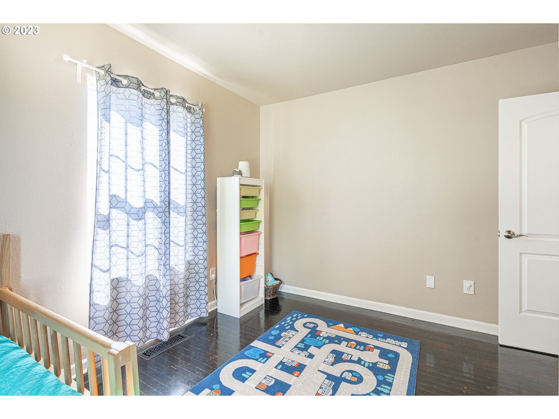 1255 North Kilpatrick Street Portland, OR 97217 - Photo 14 of 30 a bedroom with a bed and a window