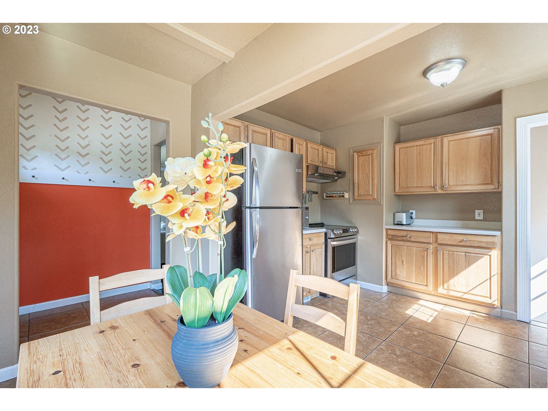 1255 North Kilpatrick Street Portland, OR 97217 - Photo 15 of 30 a kitchen with a refrigerator and a potted plant