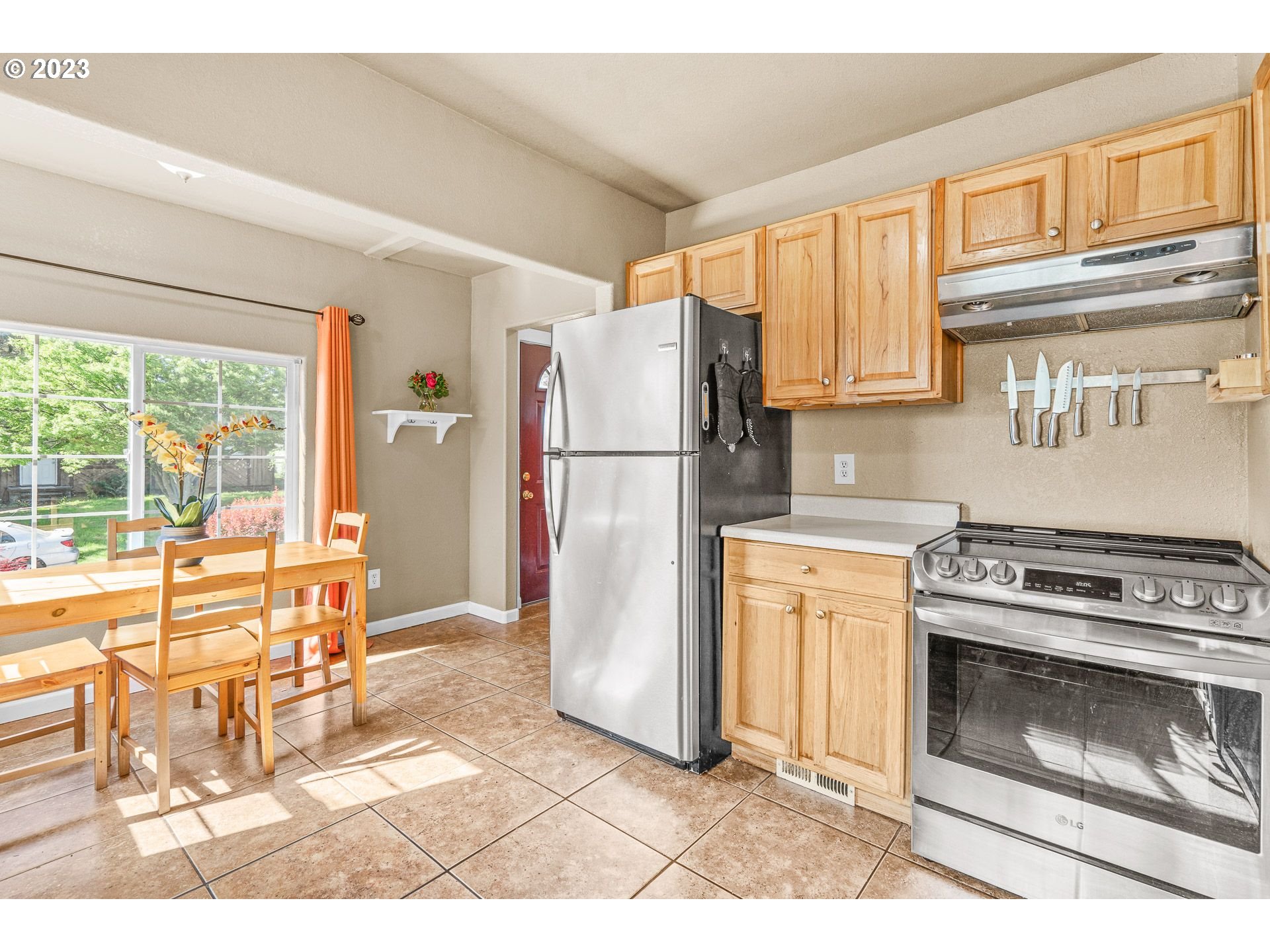 1255 North Kilpatrick Street Portland, OR 97217 - Photo 17 of 30 a kitchen with a stove a refrigerator and a stove top oven