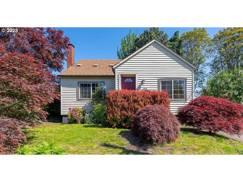 1255 North Kilpatrick Street Portland, OR 97217 - Photo 2 of 30 a house view with a garden