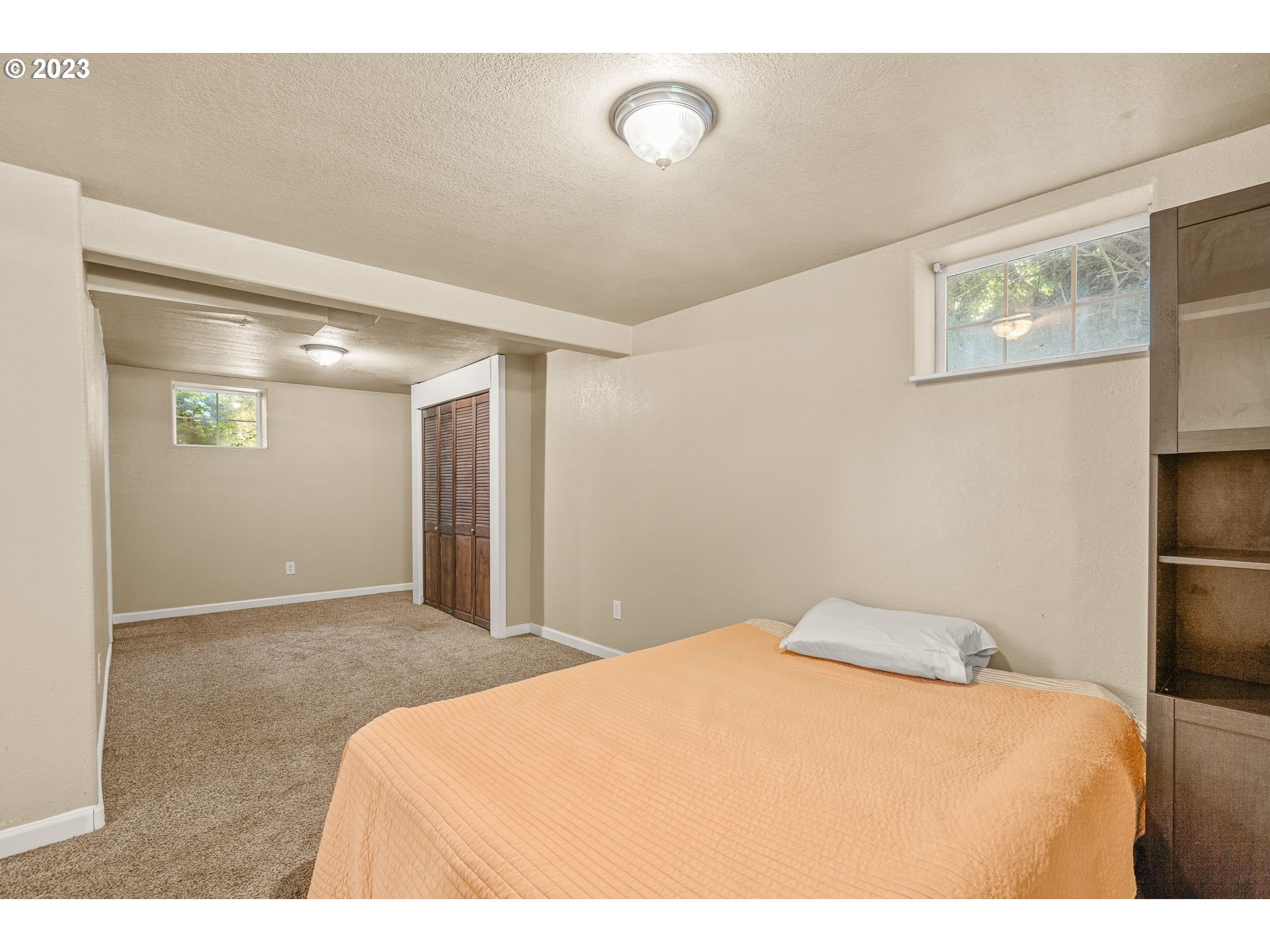 1255 North Kilpatrick Street Portland, OR 97217 - Photo 25 of 30 a bedroom with a bed and a refrigerator