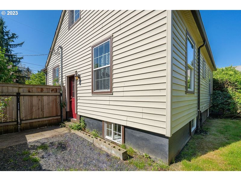 1255 North Kilpatrick Street Portland, OR 97217 - Photo 28 of 30 a view of a house with a yard