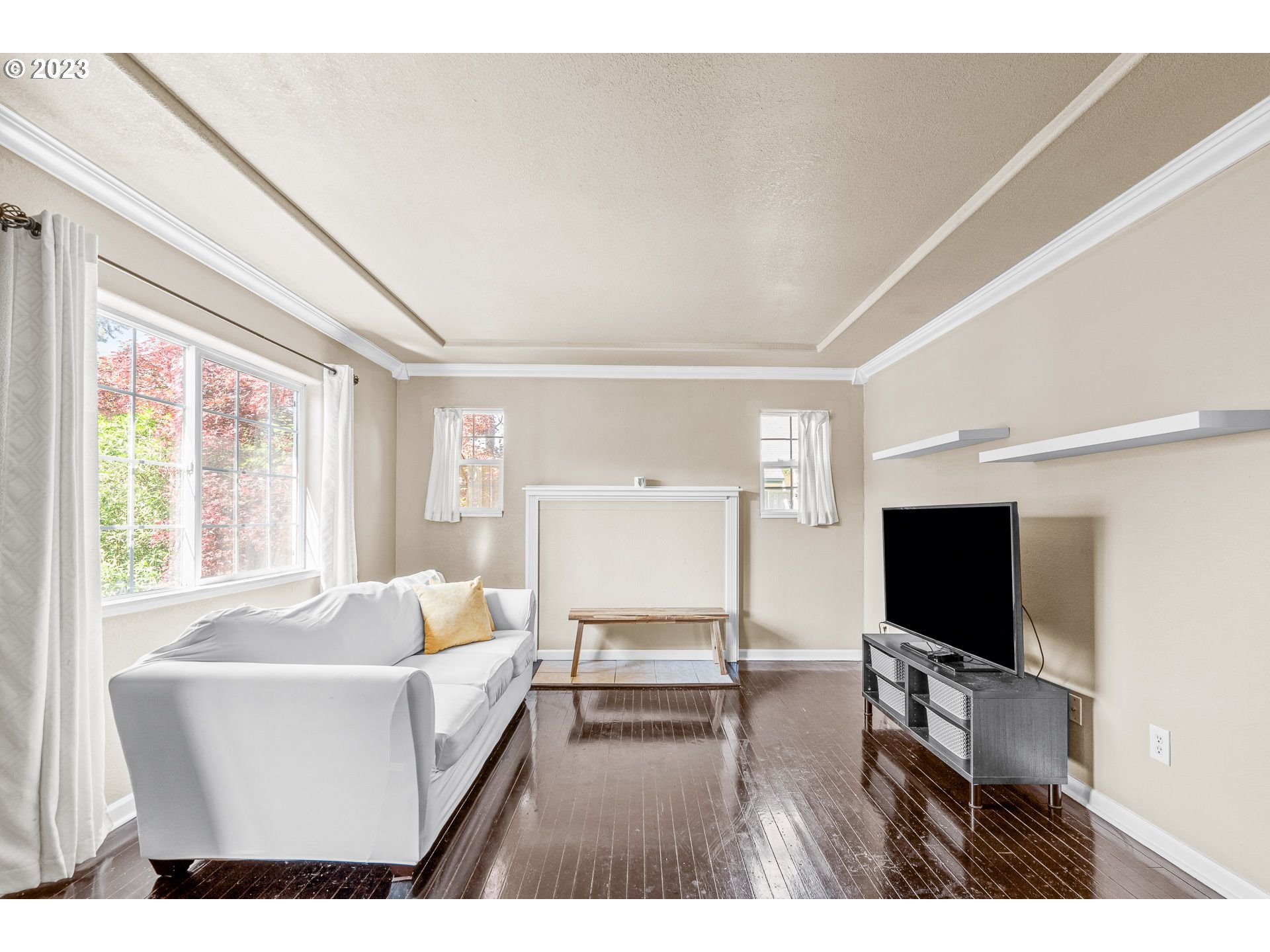 1255 North Kilpatrick Street Portland, OR 97217 - Photo 6 of 30 a living room with furniture and a flat screen tv