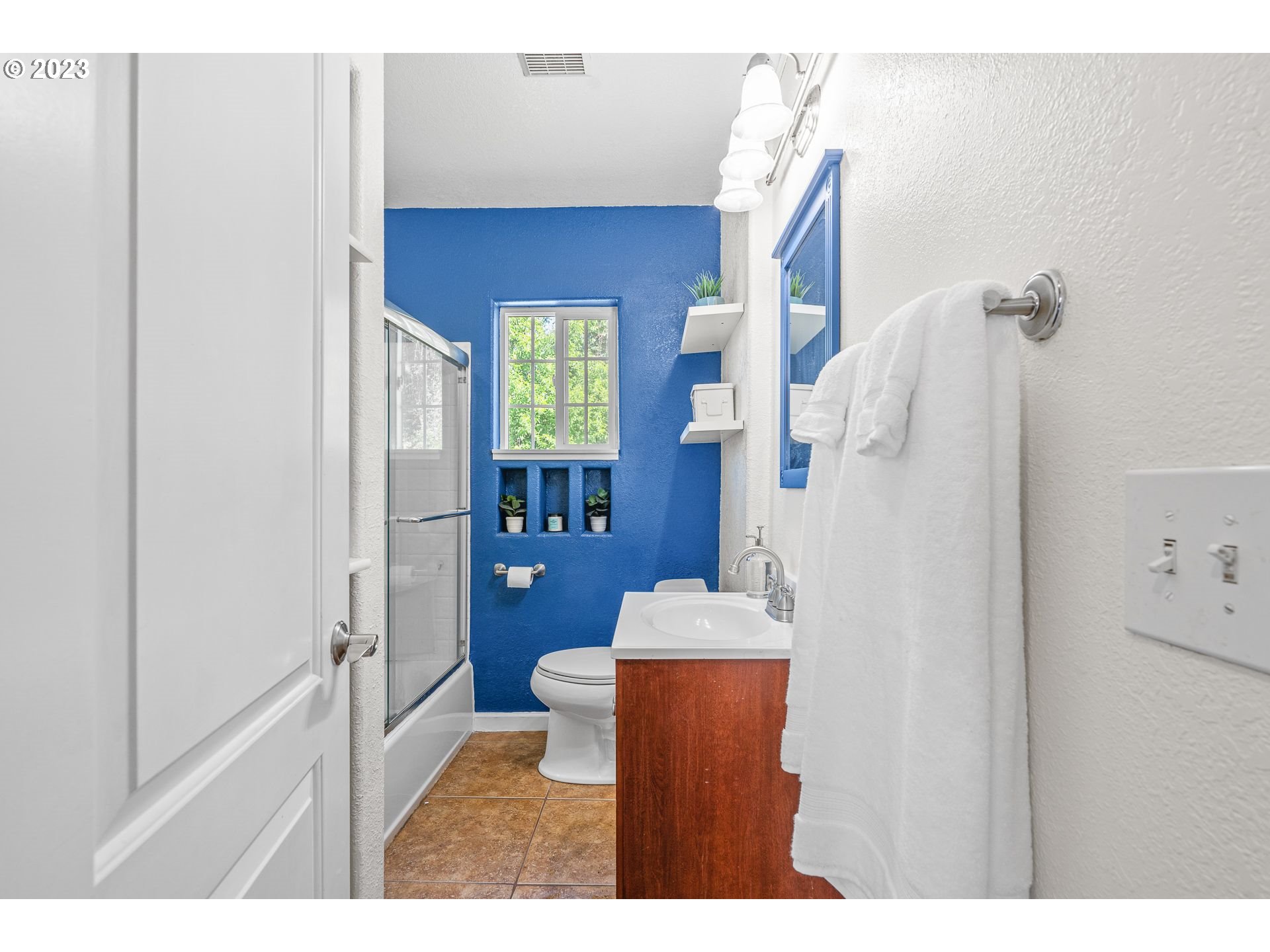 1255 North Kilpatrick Street Portland, OR 97217 - Photo 9 of 30 a living room with furniture and a wooden door
