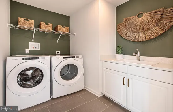a utility room with dryer and washer