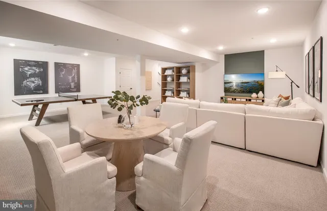 a view of a dining room with furniture and window