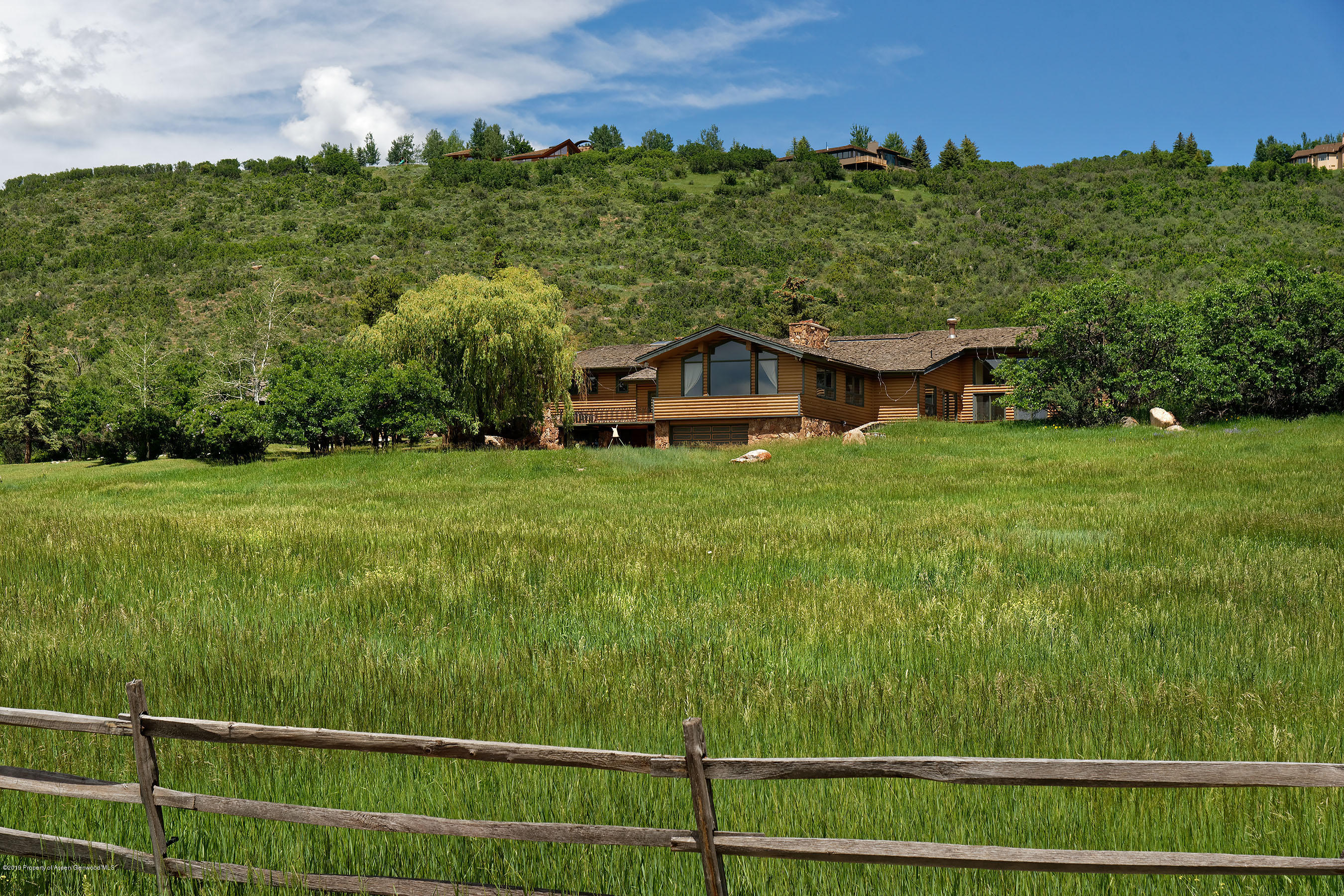 1765 McLain Flats Road Aspen, CO 81612 - Photo 11 of 73 a view of a house with a big yard
