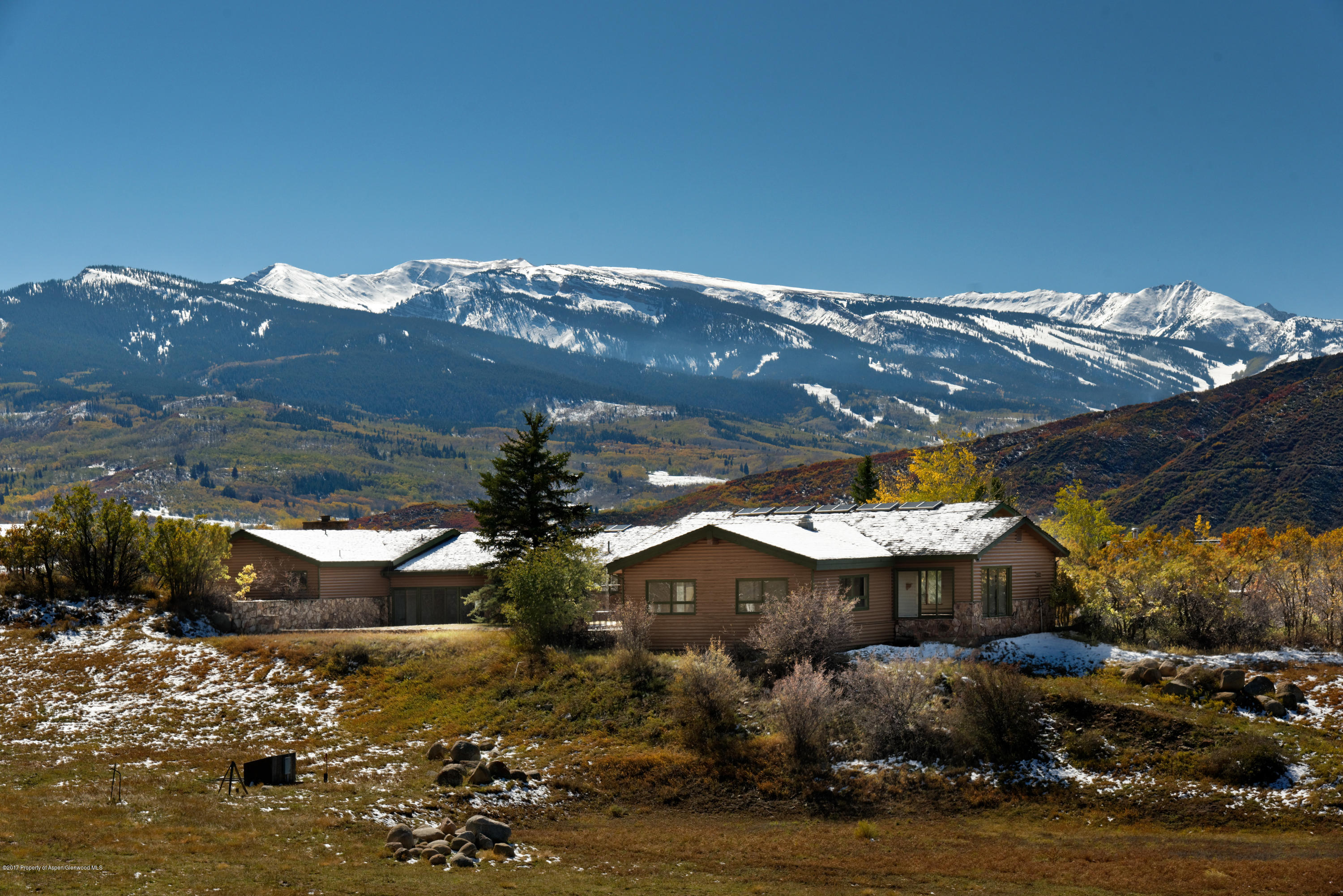 1765 McLain Flats Road Aspen, CO 81612 - Photo 19 of 73 a view of a house with a backyard