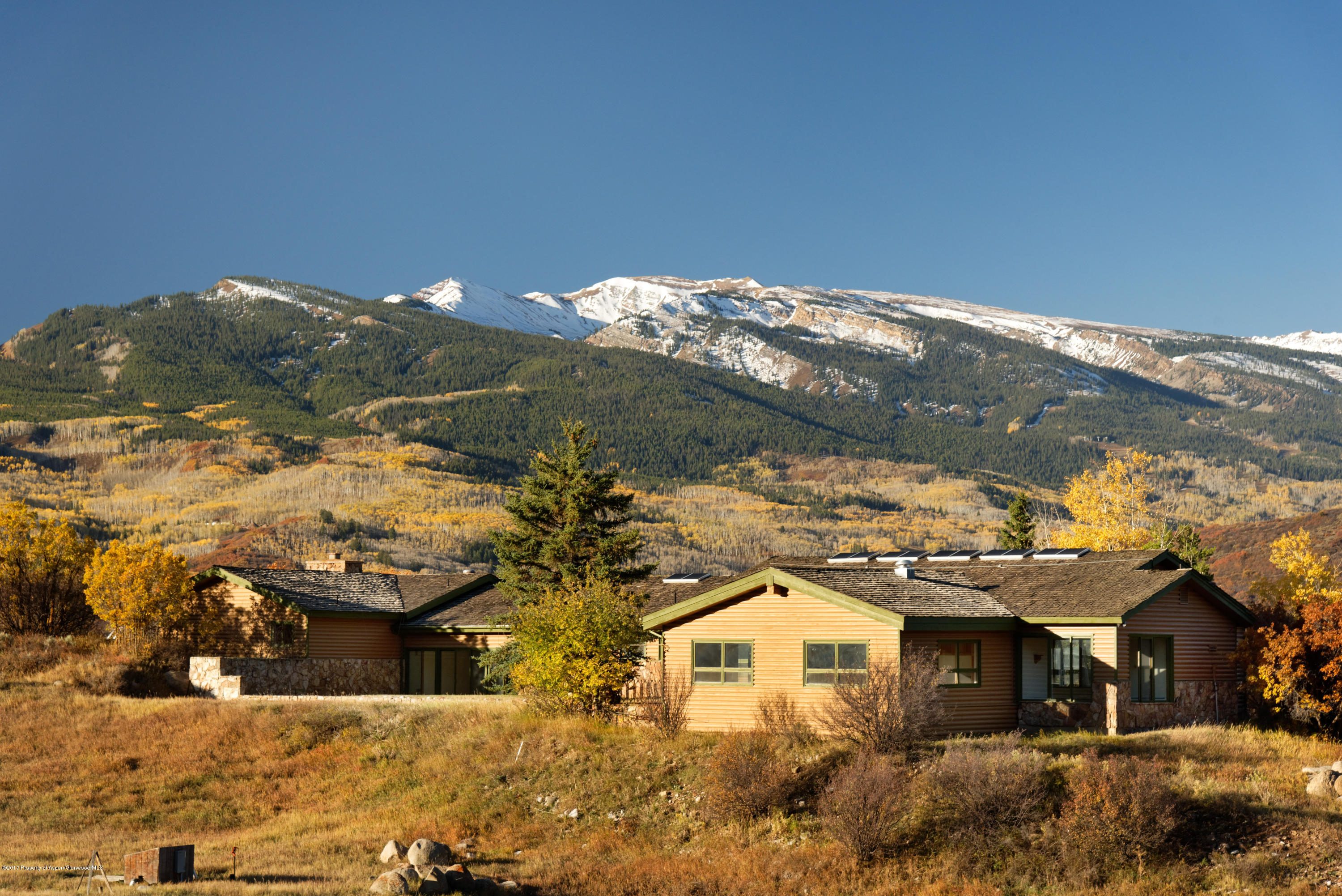 1765 McLain Flats Road Aspen, CO 81612 - Photo 31 of 73 a view of a house with a yard