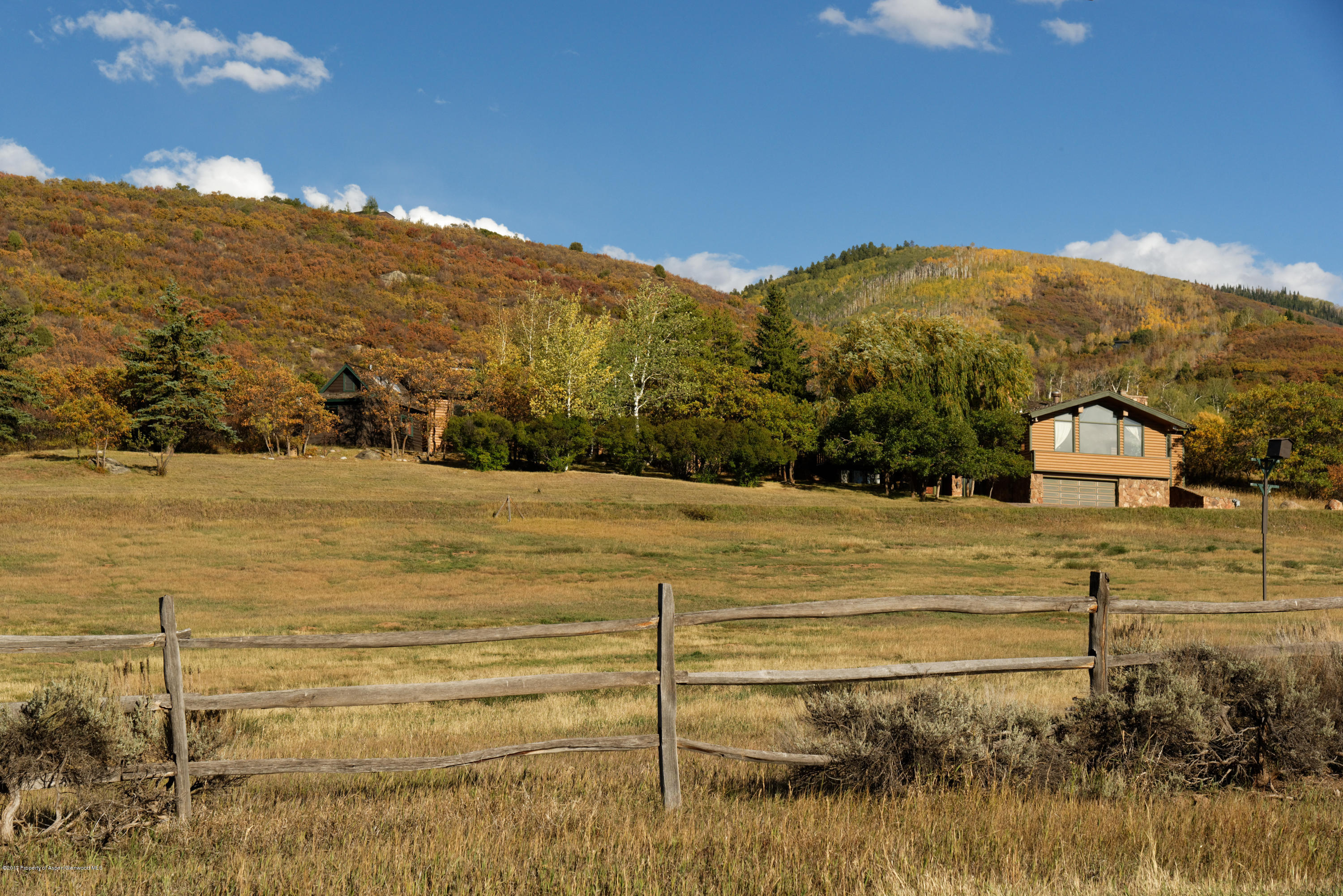1765 McLain Flats Road Aspen, CO 81612 - Photo 35 of 73 a view of a house with a yard