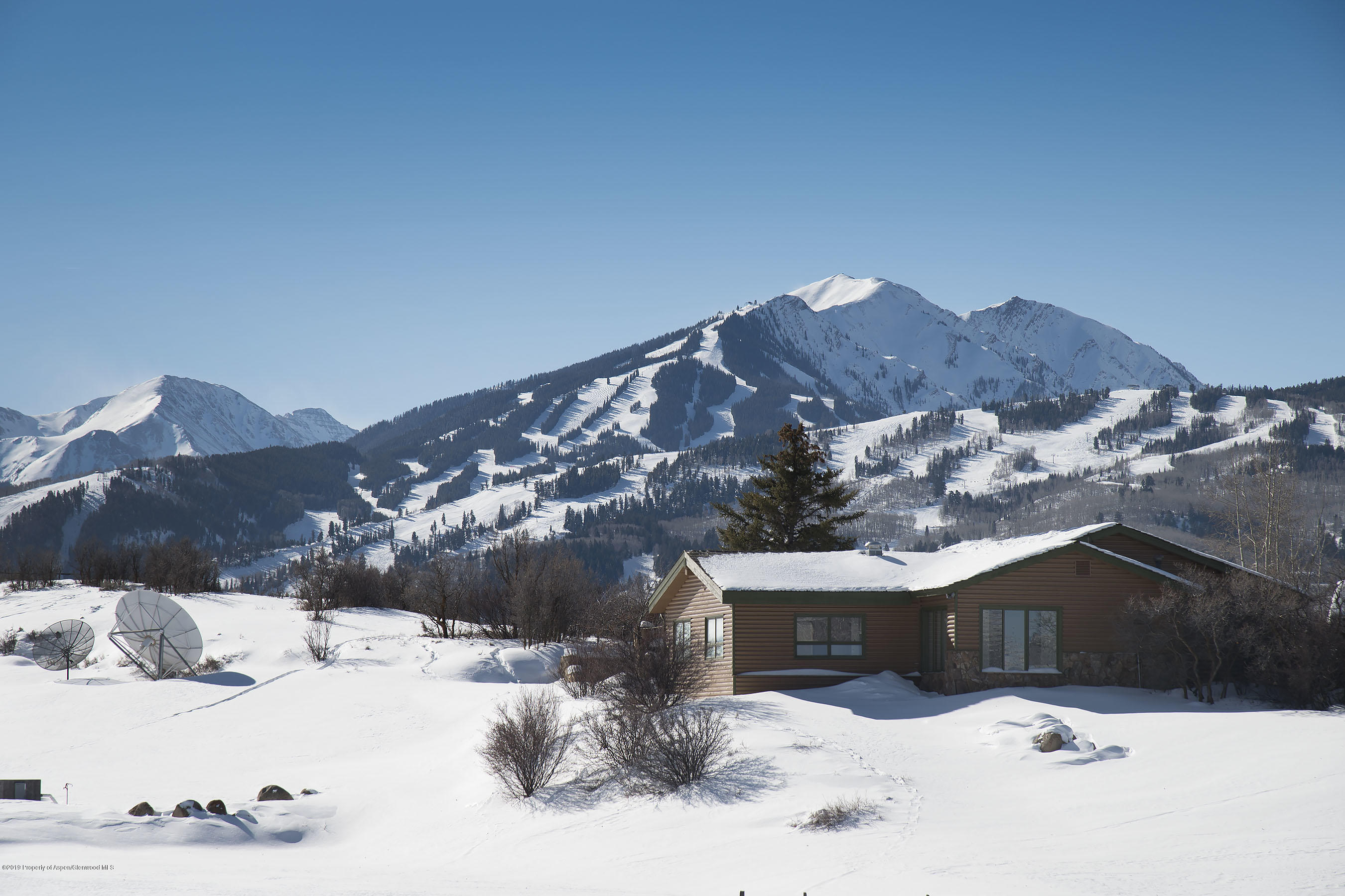 1765 McLain Flats Road Aspen, CO 81612 - Photo 45 of 73 a view of a house with a snow in the yard