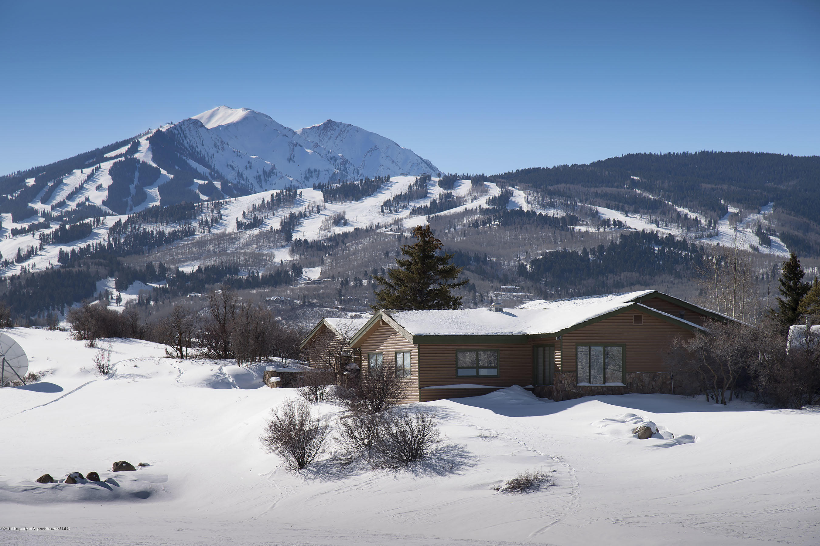 1765 McLain Flats Road Aspen, CO 81612 - Photo 48 of 73 a view of house with a yard covered in snow