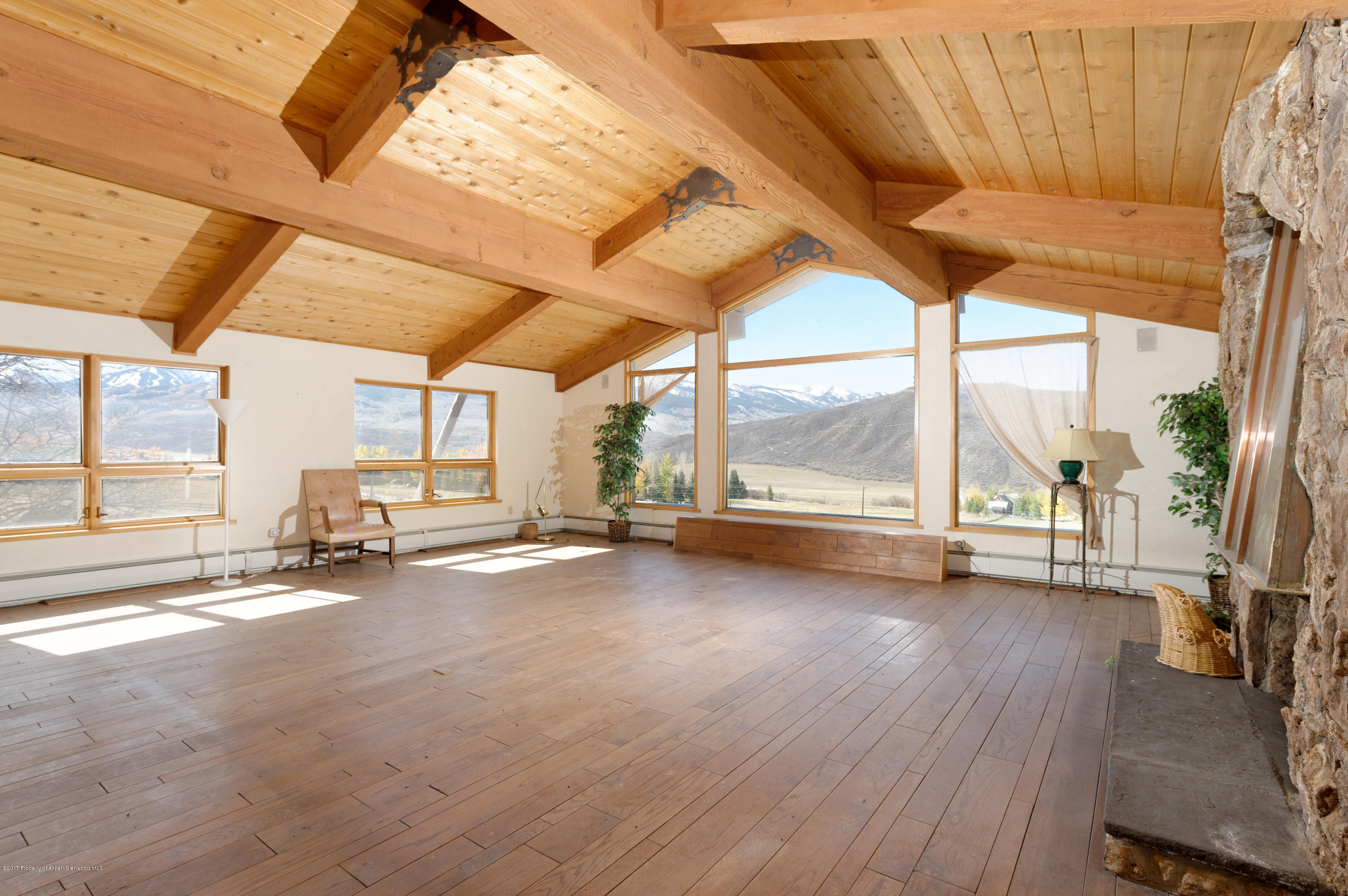 1765 McLain Flats Road Aspen, CO 81612 - Photo 55 of 73 a view of a room with wooden floor and iron stairs