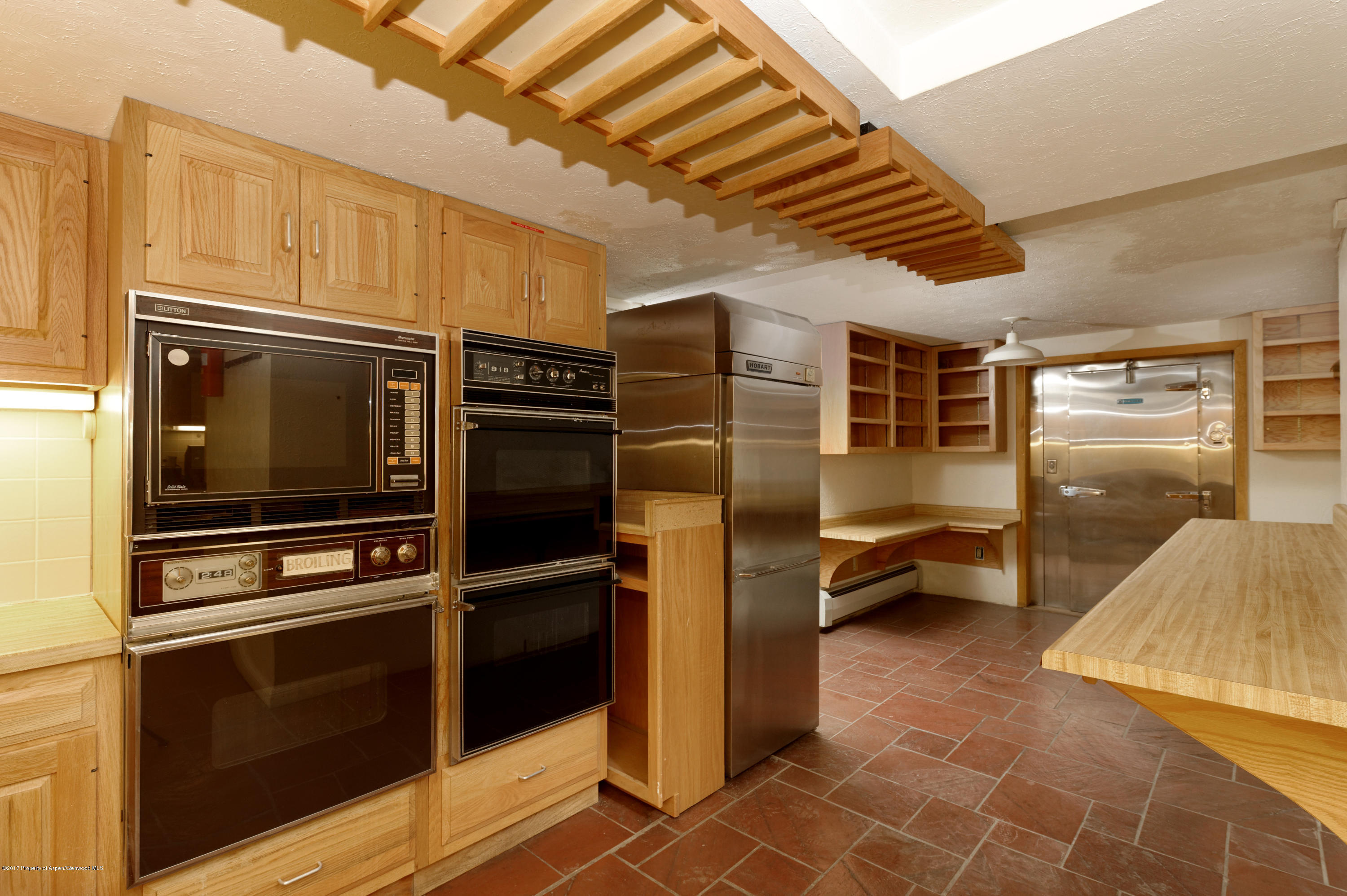 1765 McLain Flats Road Aspen, CO 81612 - Photo 59 of 73 a kitchen with stainless steel appliances granite countertop a refrigerator and a stove