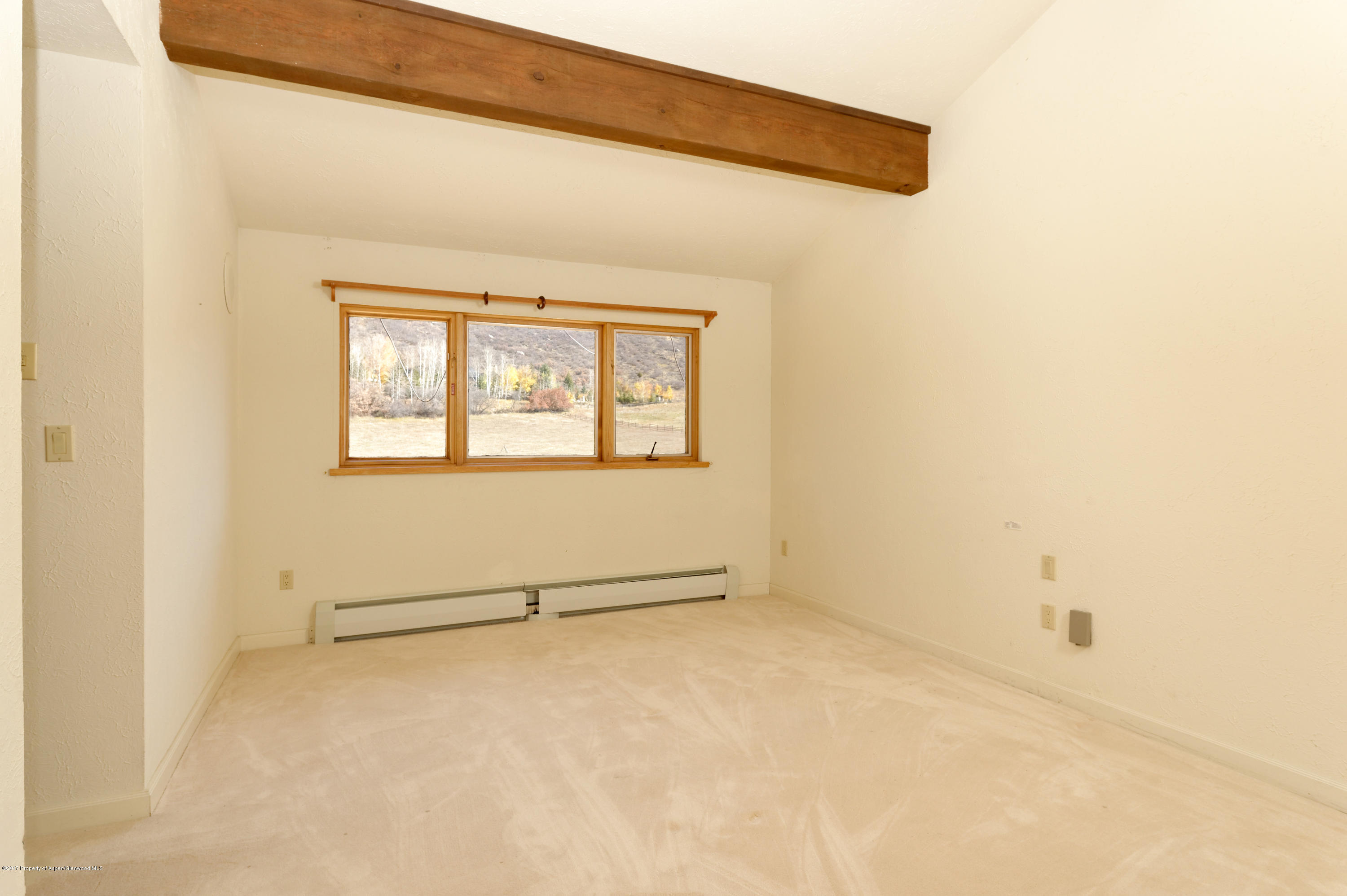 1765 McLain Flats Road Aspen, CO 81612 - Photo 62 of 73 a view of an empty room with a window