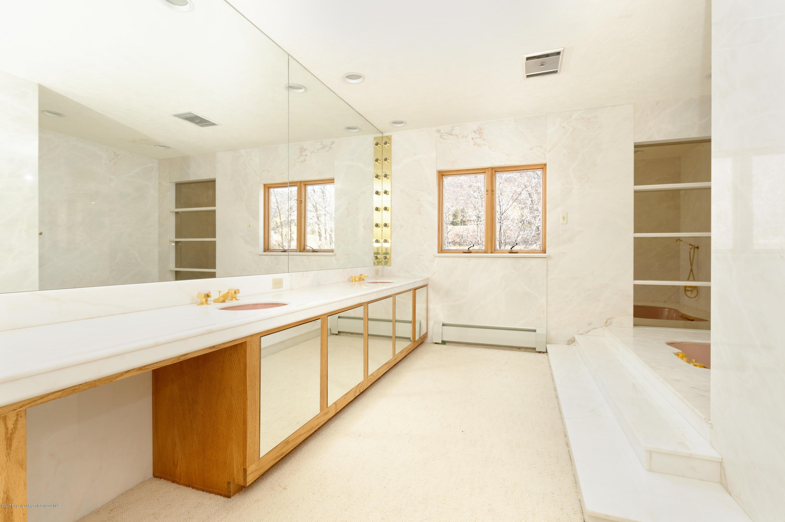 1765 McLain Flats Road Aspen, CO 81612 - Photo 63 of 73 a bathroom with a tub sink and mirror