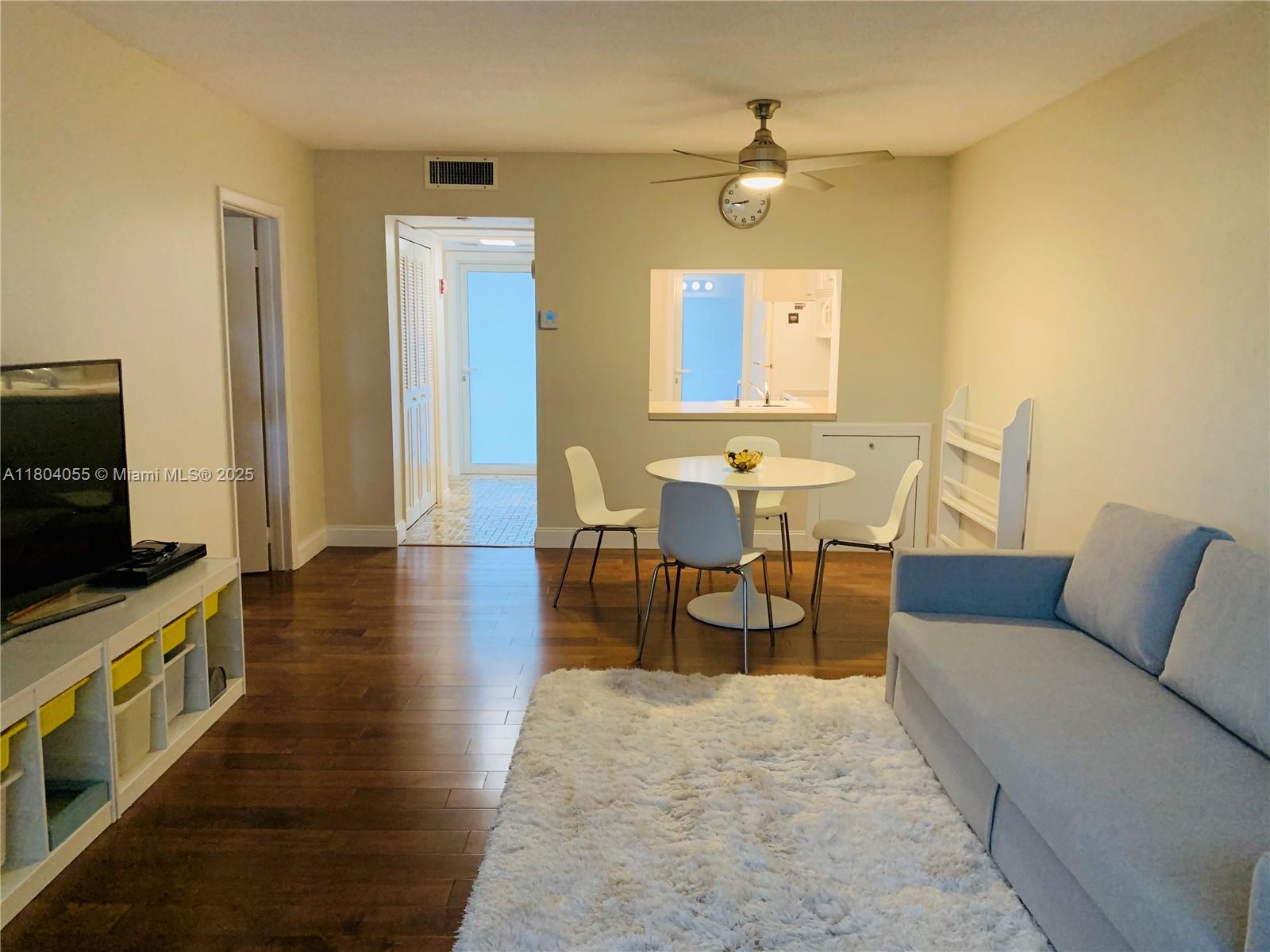 1481 South Ocean Boulevard, Unit 211E Lauderdale-by-the-Sea, FL 33062 - Photo 1 of 28 a living room with furniture and a flat screen tv