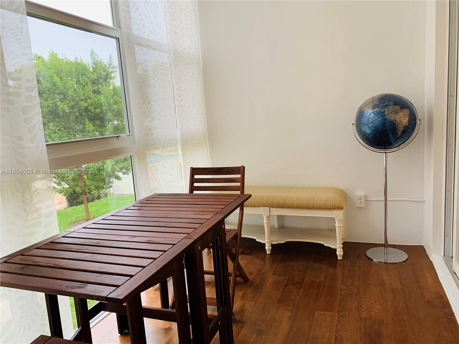 1481 South Ocean Boulevard, Unit 211E Lauderdale-by-the-Sea, FL 33062 - Photo 23 of 28 a view of a dining room with furniture and wooden floor