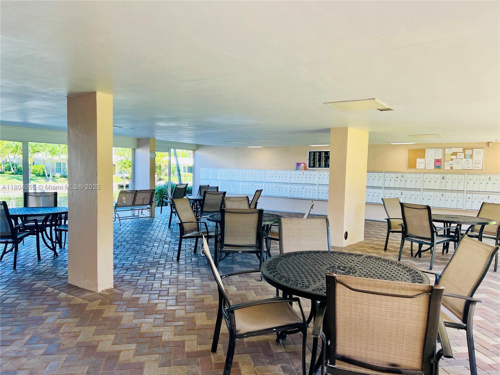 1481 South Ocean Boulevard, Unit 211E Lauderdale-by-the-Sea, FL 33062 - Photo 28 of 28 a dining room with furniture and wooden floor