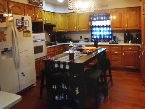 a kitchen with a sink appliances and cabinets