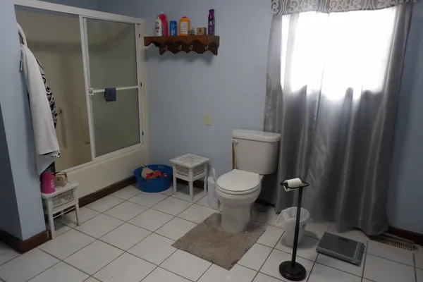 a bathroom with a toilet and a sink